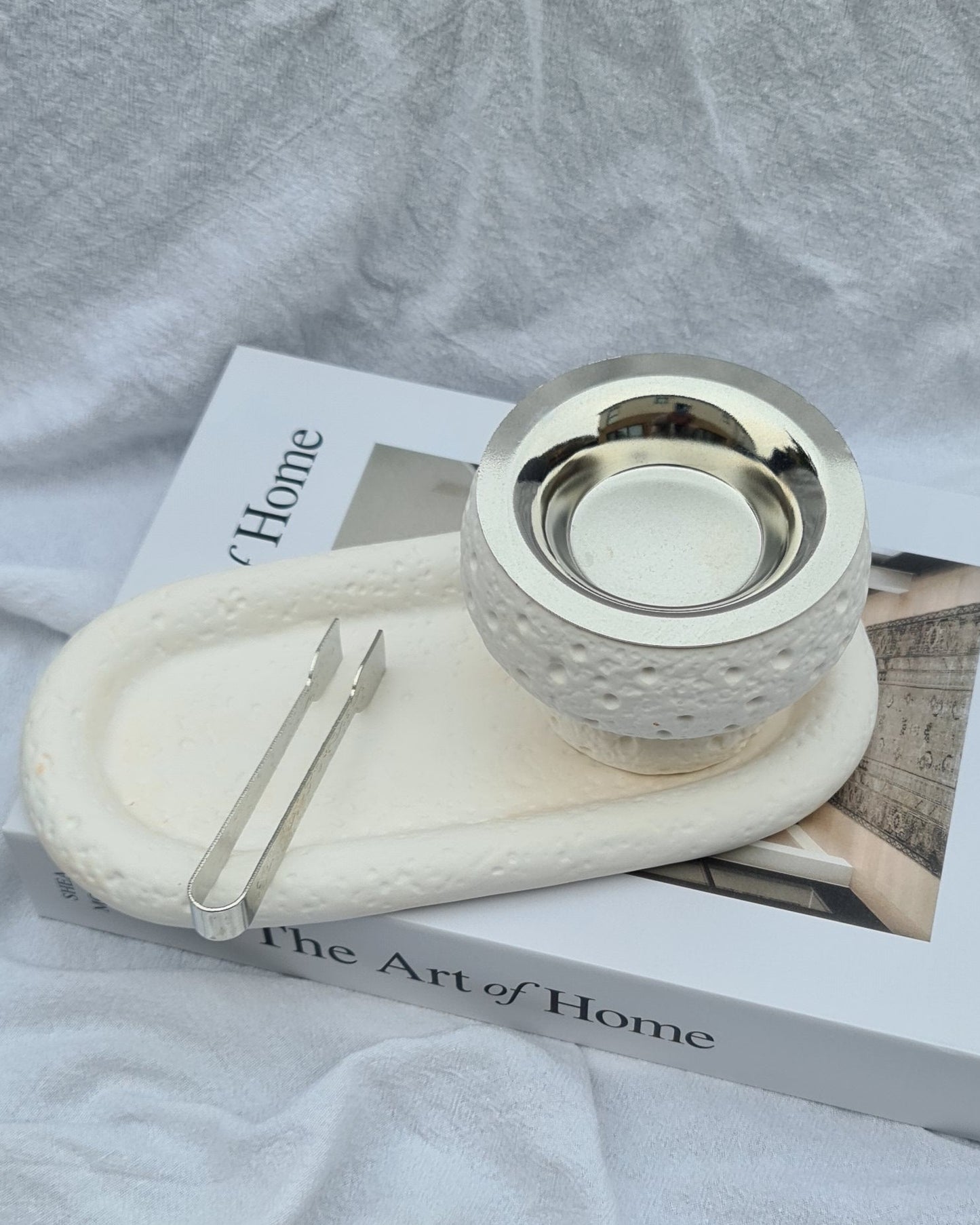 Overhead view of Maqaam incense burner and tray with metal tong — handmade cast stone set for incense or display.