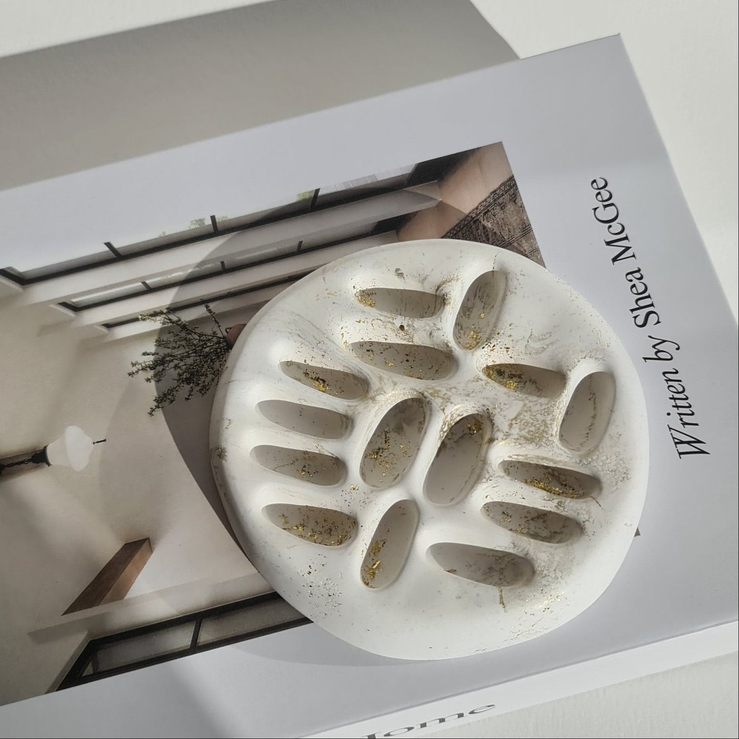 White with gold accent on a book with white background