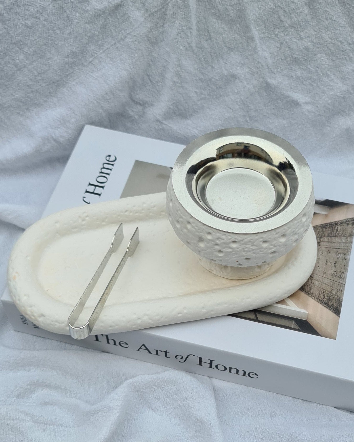 Overhead view of Maqaam incense burner and tray with metal tong — handmade cast stone set for incense or display.