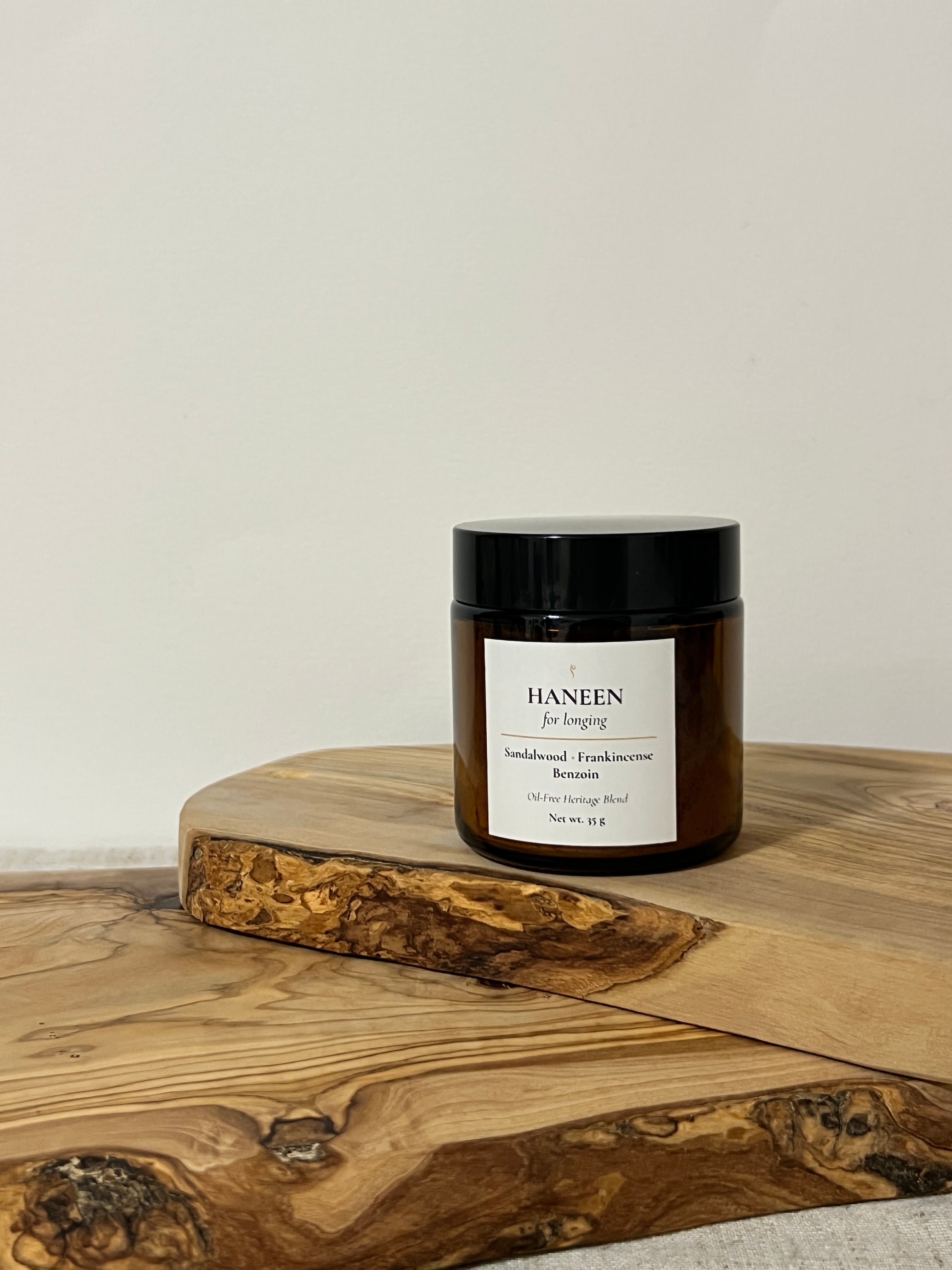 Jar with a label on a wooden surface